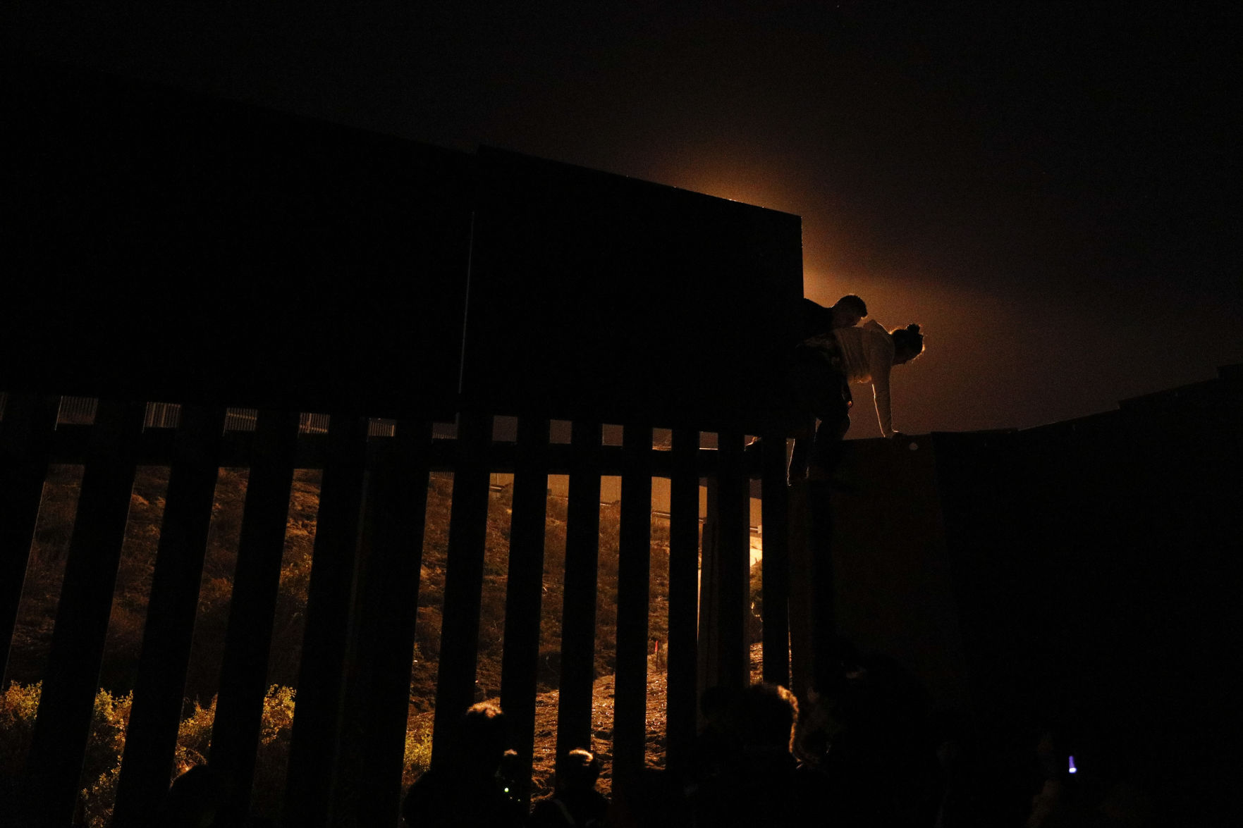 Central America Migrant Caravan - Jumping the Wall Photo Gallery